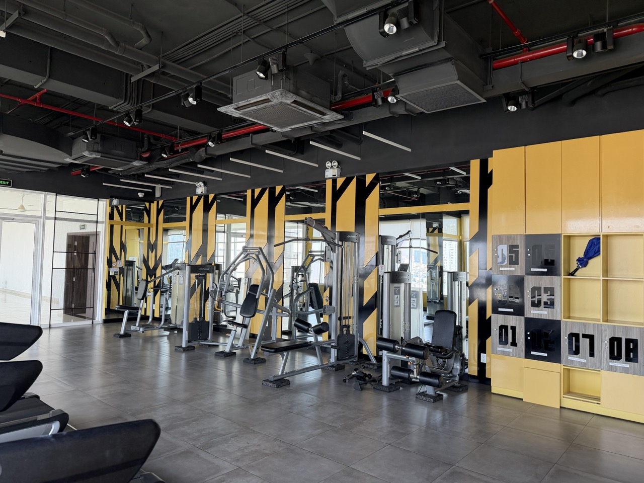 Modern fitness center available for guests staying at Sazia Home serviced apartment in District 7, Ho Chi Minh City.